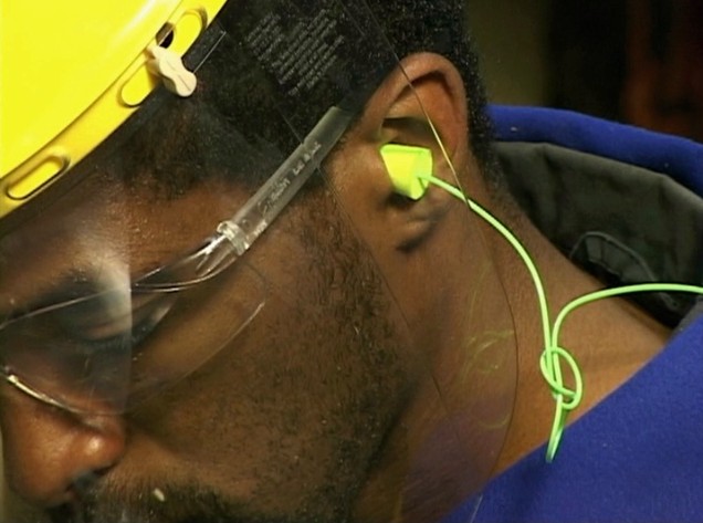 A worker using proper hearing protection and following his facility's hearing conservation program