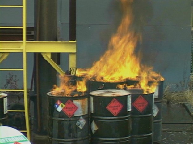 An example of a dangerous workplace fire that was preventable involving some chemical barrels
