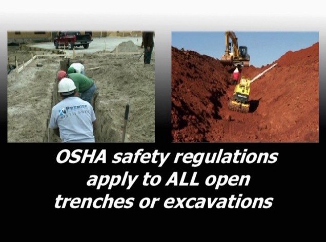 Workers in an open trench and a machine on an excavation site where OSHA safety regulations apply