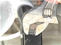 A hand tool in use by a worker who is aware of potential dangers and is behaving in a safe manner