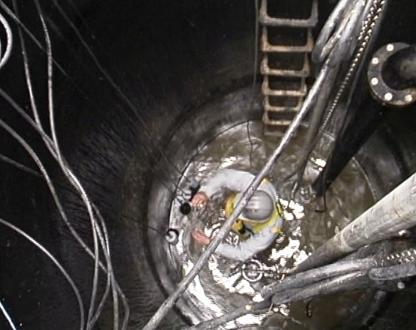 A worker in a confined space unaware of proper safety procedures and the entry permit system 