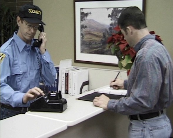 Employees following security procedures to help keep all workers safe and secure at work