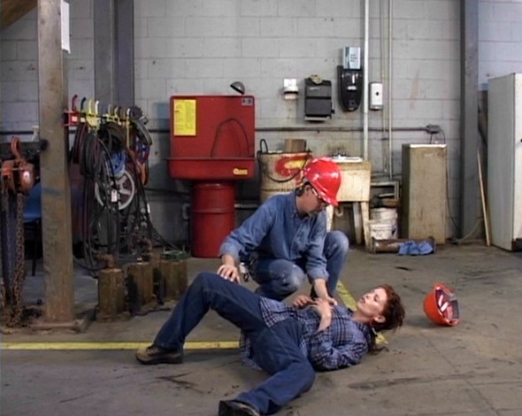 A re-enactment of a workplace accident resulting in a worker being injured from a slip, trip or fall