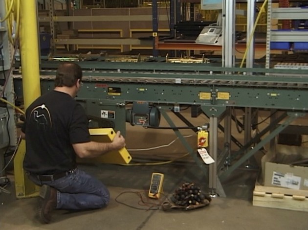 A maintenance worker avoiding injury by following his safety training and best work practices