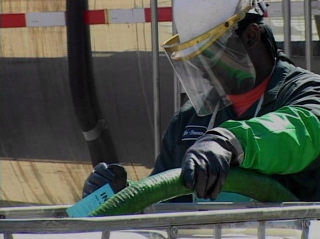 A worker demonstrating the proper use of PPE or personal protective equipment in the workplace