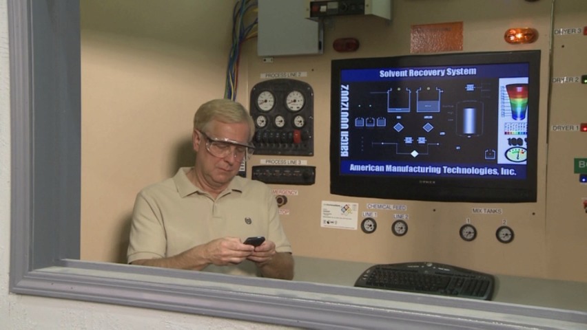 A worker distracted on the job by his cell phone creating a dangerous and unsafe work environment