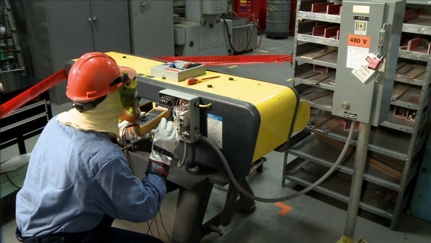 A qualified electrical worker wearing the proper PPE and utilizing safe electrical work practices