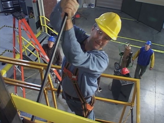 Maintenance workers using safe work procedures to reduce the chance of getting injured while at work