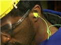 A worker using proper hearing protection and following his facility's hearing conservation program