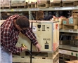 A warehouse worker unaware of potential workplace hazards and put himself in the line of fire