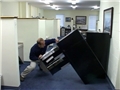 An office worker injured by a filing cabinet tipping over because safe work practices were ignored