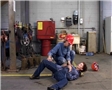 A re-enactment of a workplace accident resulting in a worker being injured from a slip, trip or fall