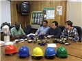 A manager training workers on the respiratory protection program and OSHA regulations standard