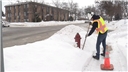 A worker in a cold environment attempting to stay safe and avoid the hazards of cold stress