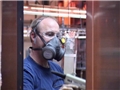 An industrial worker following the OSHA Respiratory Protection Standard and safety training