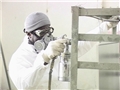 A worker wearing the proper respiratory protection to avoid potential workplace hazards and injury